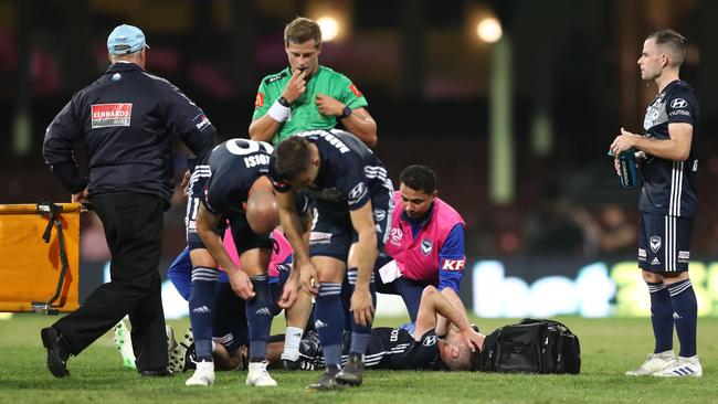 Melbourne Victory’s Terry Antonis receives attention at the SCG on Saturday night. Picture: Getty Images