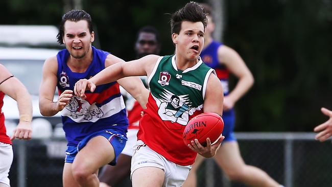 Action from the AFL Cairns match between the Centrals Trinity Beach Bulldogs and the South Cairns Cutters, held at Crathern Park, Trinity Beach. Souths' Karl Petri looks to offload. Picture: BRENDAN RADKE