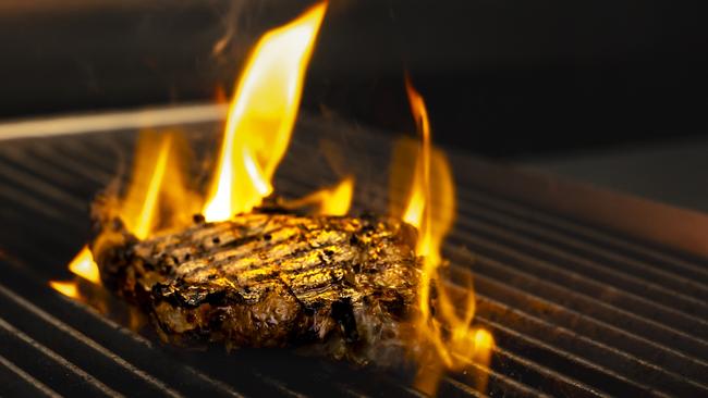 One of Hampden Bar &amp; Bistro’s succulent steaks on the grill. Picture: Sammy Jones Photography