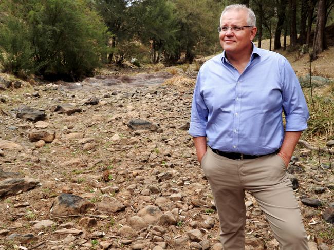 Prime Minister Scott Morrison visiting the Dungowan Dam near Tamworth last year to announce $1 billion dollars in new funding for dams in NSW. Picture: Adam Taylor