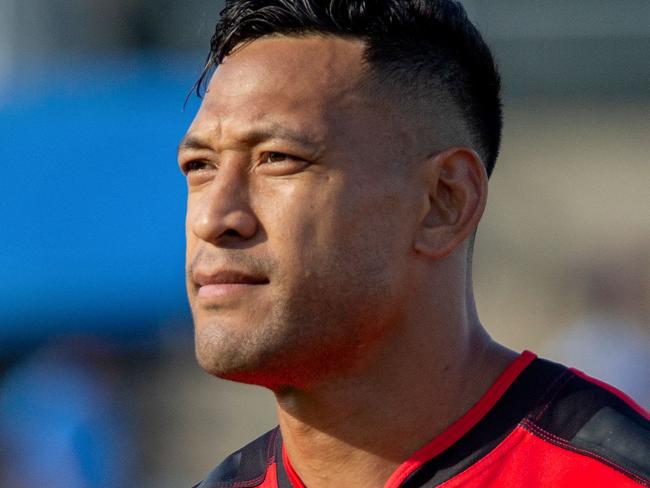 Former Australian rugby player Israel Folau (R) with Tongan teammates sing national anthem prior to the World Rugby Pacific Nations Cup match between Fiji and Tonga at HFC Stadium in Fiji's capital city Suva on July 2, 2022. (Photo by Leon LORD / AFP)