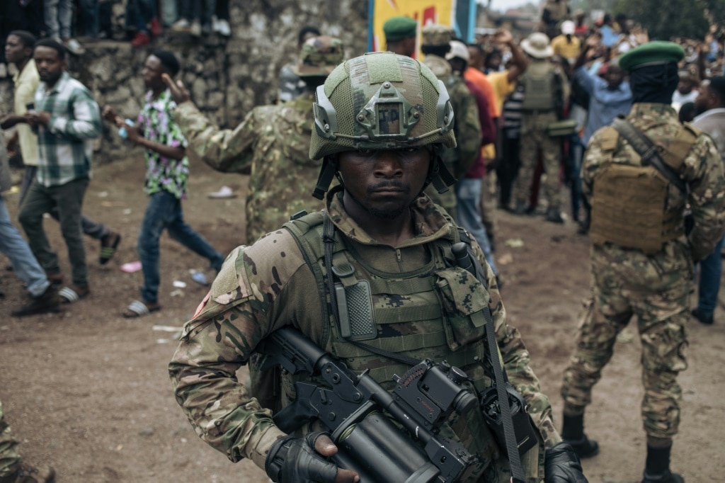 An M23 fighter at a stadium in Goma, the biggest city in eastern DRC, which the Rwanda-backed armed group has seized