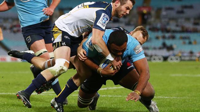 Wycliff Palu dives over to score a try the Waratahs.