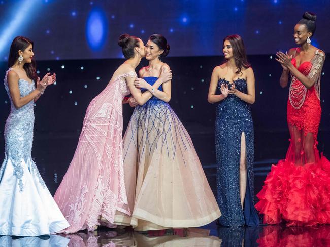 Miss Philippines Catriona Elisa Gray kisses Miss Indonesia Natasha Mannuela during the Miss World Grand Final of the Miss World 2016 pageant at the MGM National Harbor December 18, 2016 in Oxon Hill, Maryland. Picture: AFP