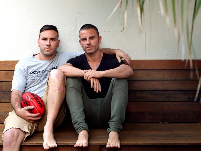 Bali bombing victims Mitchell, left, and Jake Ryan remembering teammate Billy Hardy who was killed. Pic by Luke Marsden.