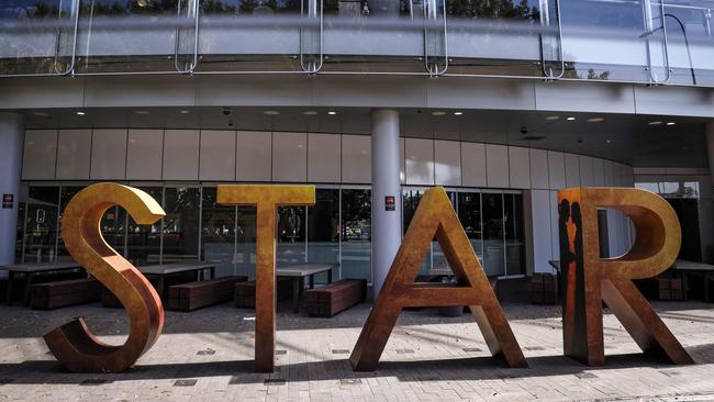 A sign stands outside The Star casino and event centre in Sydney on September 2, 2024. Troubled resort and casino operator Star Entertainment was temporarily delisted from the Australian Securities Exchange on September 2 after failing to post its annual financial results. (Photo by DAVID GRAY / AFP)