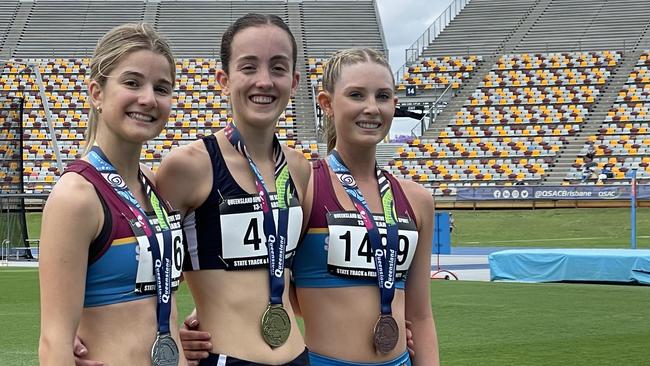 South Coast pair, Tess Hannigan and Lainey Mathiske flank Met East's Kobi Walker.