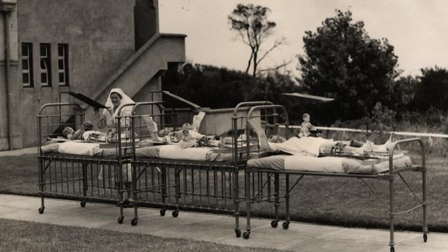 Children lie outside in their hospital beds at the Children's Hospital’s orthopaedic section in Mt Eliza; circa 1937. The hospital embraced heliotherapy, the belief that sunlight could treat a range of ailments. Picture: Royal Children’s Hospital Archives