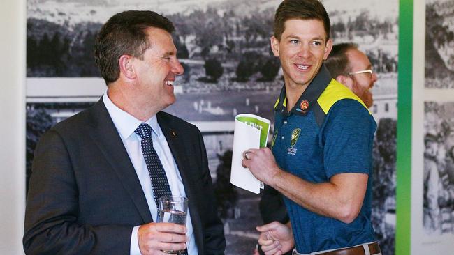 Former Australia Test captain Mark Taylor shares a laugh with current skipper Tim Paine.