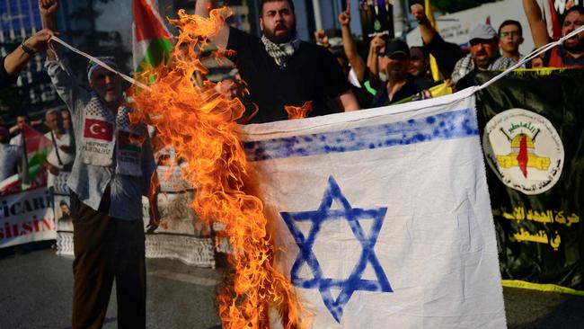 Demonstrators burn a homemade Israeli flag following the assassination of Hezbollah leader Hassan Nasrallah during a protest rally in Istanbul. Picture: Yasin Akgul/AFP