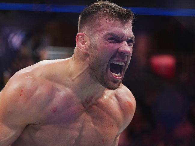 LAS VEGAS, NEVADA - JULY 08: Dricus Du Plessis of South Africa reacts after his knockout victory over Robert Whittaker of New Zealand in a middleweight fight during the UFC 290 event at T-Mobile Arena on July 08, 2023 in Las Vegas, Nevada. (Photo by Cooper Neill/Zuffa LLC via Getty Images)