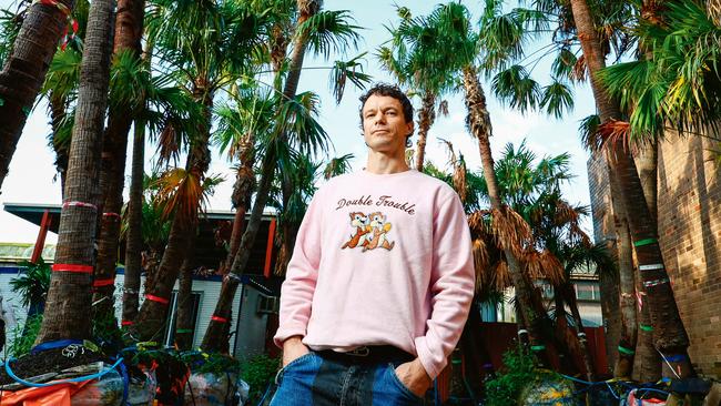 Conceptual artist Mike Hewson with some of the rescue palms featuring in his new Coal Loader, Palm Grove installation at the redeveloped Sydney Fish Market. Picture: John Feder/The Australian