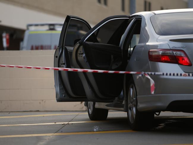 One of the shot men was driven to Bankstown Hospital in this car which was taped off by police.