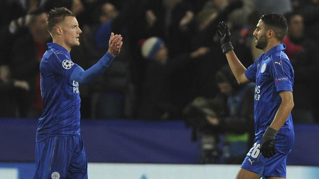 Leicester's Riyad Mahrez, right, celebrates with Leicester's Jamie Vardy.