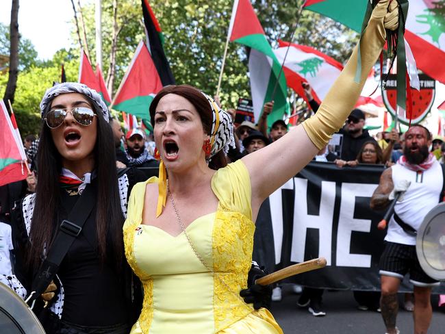 SYDNEY, AUSTRALIA - NewsWire Photos OCTOBER 6, 2024: Protestors march on the streets of the Sydney CBD. Protestors gather at Hyde Park in Sydney's CBD to demand an end to the ongoing war and Israel's current occupation of Gaza, and the escalating Israel-Lebanon conflict.Picture: NewsWire / Damian Shaw