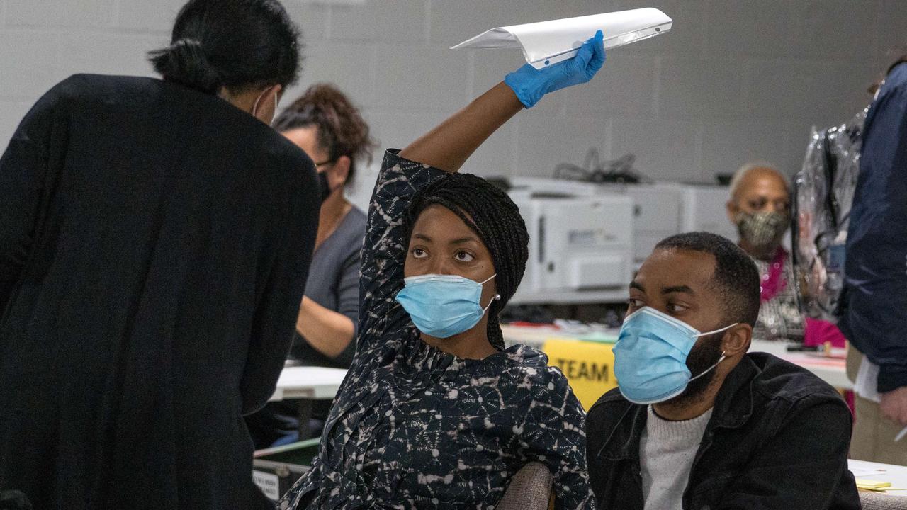 Gwinnett County election workers handle ballots as part of the recount for the 2020 presidential election in Lawrenceville, Georgia. Picture: Megan Varner/Getty Images/AFP