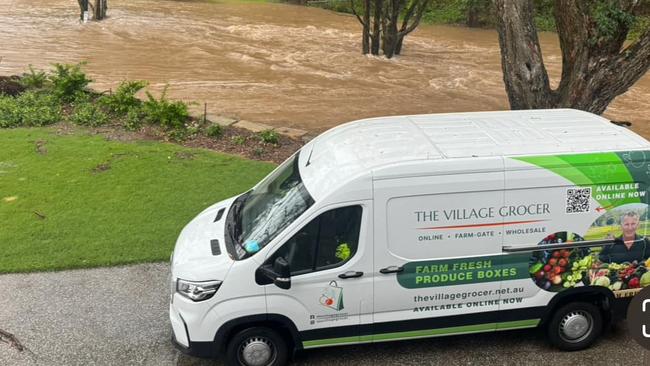 Flash flooding has inundated Will Feenstra's Guanaba farm on the bank of Guanaba Creek, destroying stock for The Village Grocer. Picture: Supplied