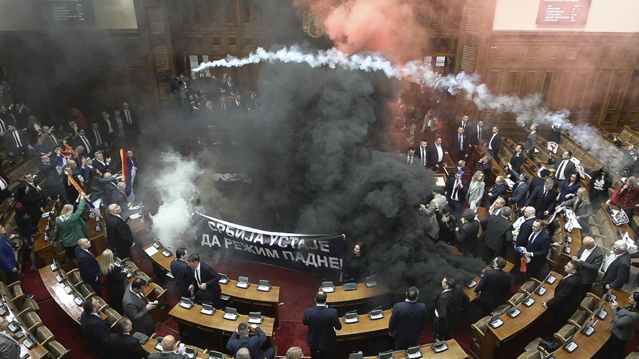 Wild scenes as pollies hurl smoke bombs, flares