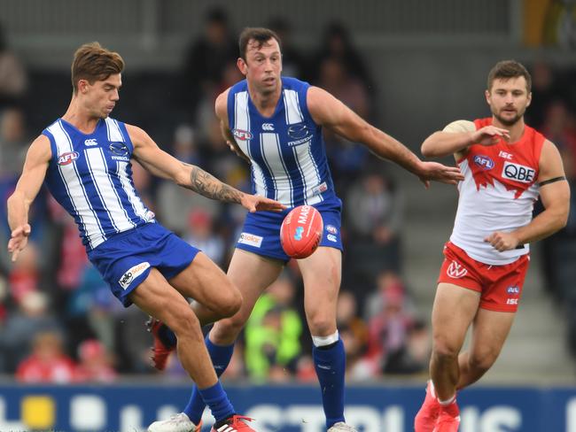 HOBART, AUSTRALIA - MARCH 09: Jy Simpkin of the kangaroos kicks the ball during the 2020 Marsh Community Series AFL match between the North Melbourne Kangaroos and the Sydney Swans at Kingston Town Oval on March 09, 2020 in Hobart, Australia. (Photo by Steve Bell/Getty Images)