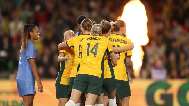 MELBOURNE, AUSTRALIA – JULY 14: Mary Fowler of the Matildas celebrates scoring a goal with teammates during the International Friendly match between the Australia Matildas and France at Marvel Stadium on July 14, 2023 in Melbourne, Australia. (Photo by Robert Cianflone/Getty Images)