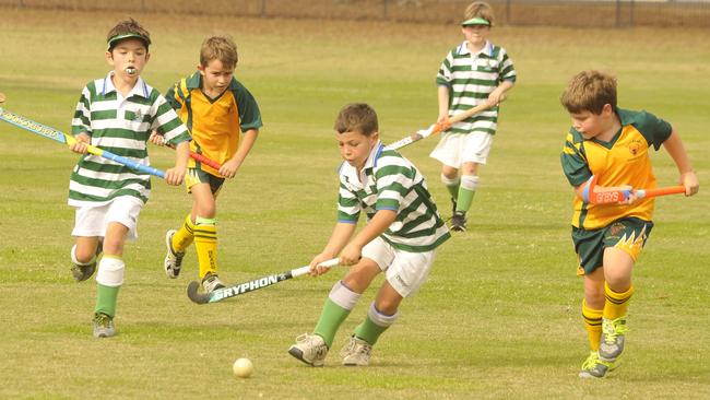 Junior Hockey action between Under 9 Cromack Transport City Bears (yellow) v Royals Yowies (green)