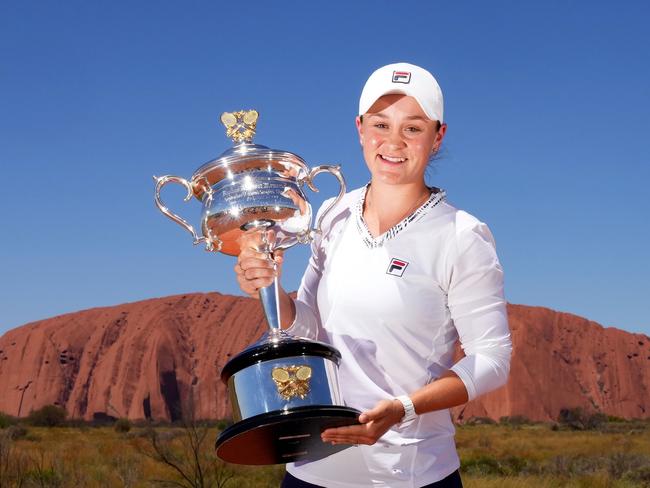 Ashleigh BARTY (AUS) poses with the Daphne Akhurst Memorial Cup as she visits Uluru in the Uluru-Kata Tjuta National Park, Australia on Friday, February 25, 2022. MANDATORY PHOTO CREDIT Scott Barbour/TENNIS AUSTRALIA