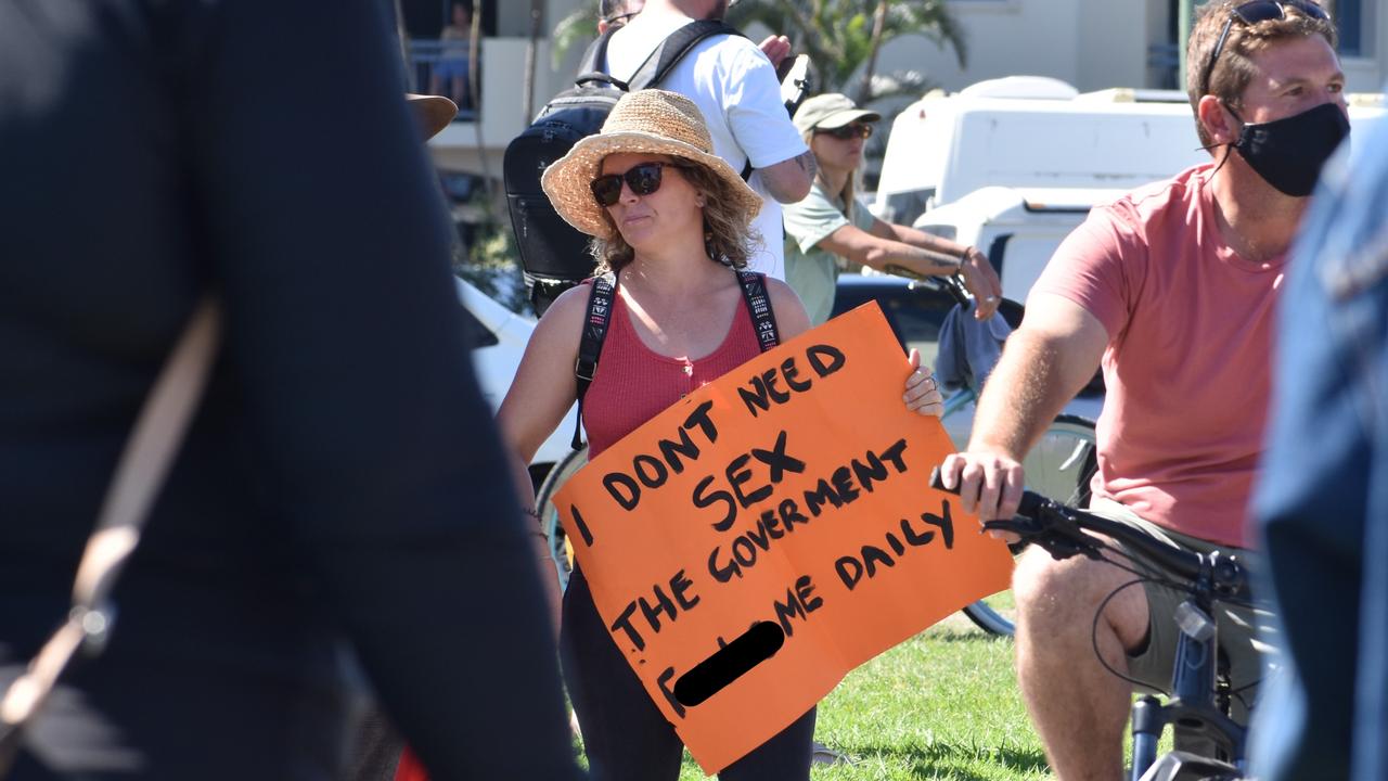 Woman’s sign reads ‘I don’t need sex the government f---s me daily’. Photo: Liana Walker