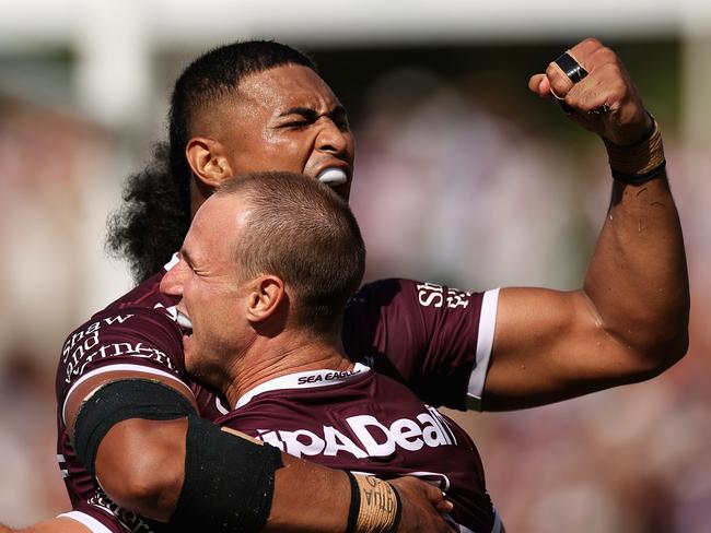 SYDNEY, AUSTRALIA - MARCH 04: Daly Cherry-Evans of the Sea Eagles celebrates scoring a try with Haumole Olakau'atu of the Sea Eagles during the round one NRL match between the Manly Sea Eagles and the Canterbury Bulldogs at 4 Pines Park on March 04, 2023 in Sydney, Australia. (Photo by Cameron Spencer/Getty Images)