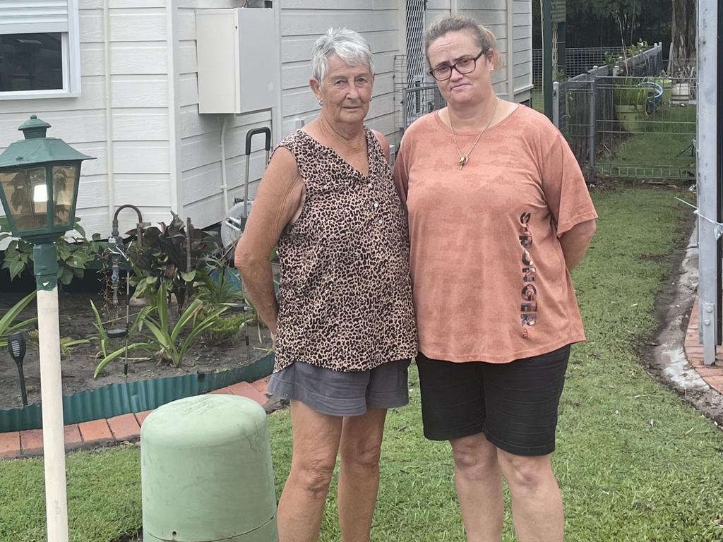 Sugar Coast Village Urangan residents Kay Campbell and Angela Hough had minimal damage to their homes, but say they were disappointed by a drain behind their homes that quickly sent water towards them.