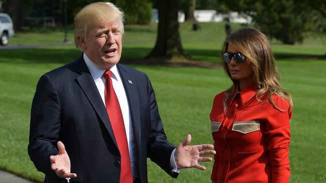 US President Donald Trump speaks about Hurricane Irma watched by First Lady Melania Trump upon return to the White House in Washington. Picture: AFP