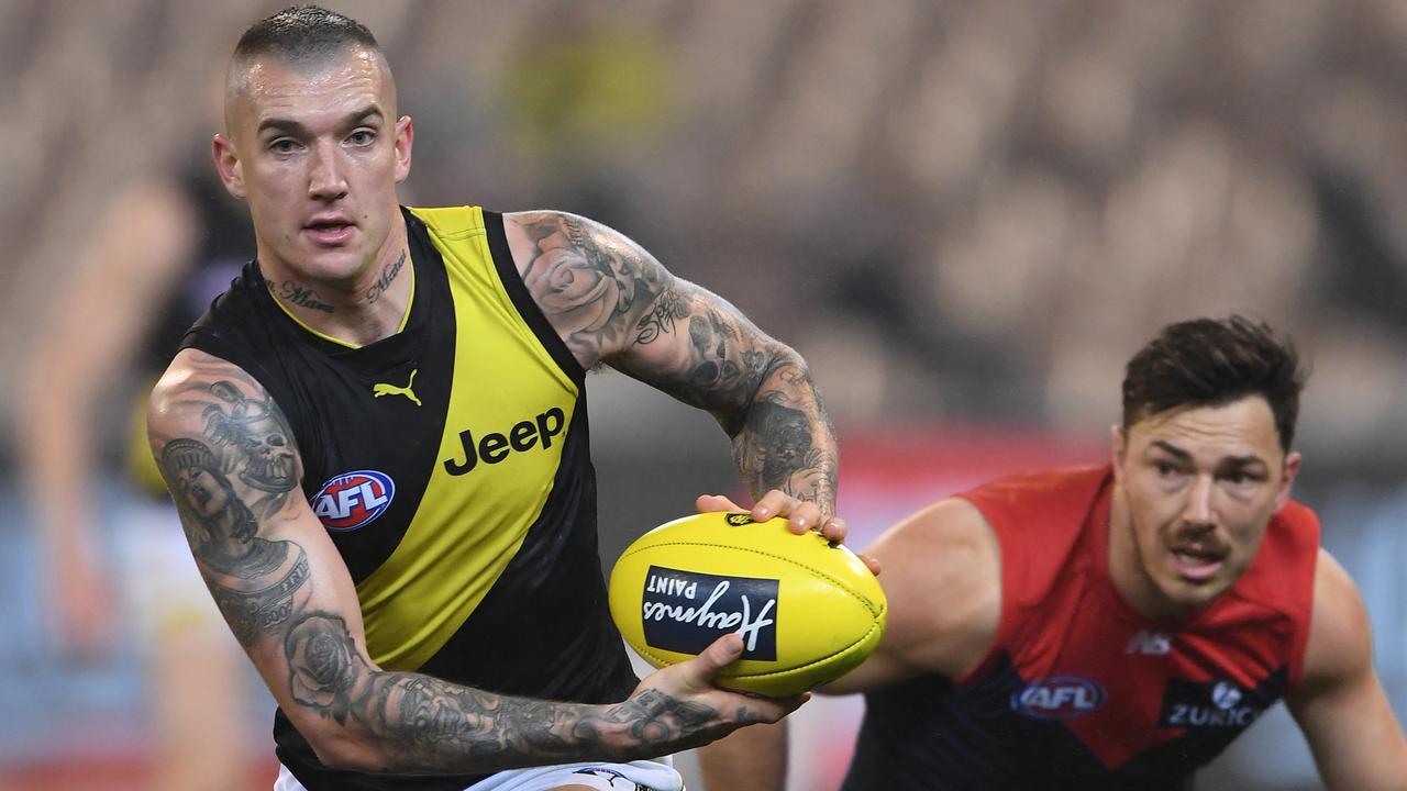 Dustin Martin dashes away against Melbourne. Picture: AAP