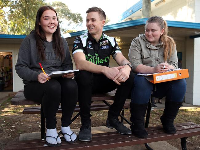 V8 Supercar champion Mark Winterbottom with two success stories Kellyann Dubos, left and Shannon O'Connor. Picture: Sam Ruttyn