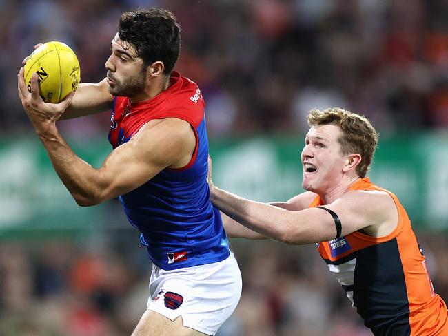 CANBERRA, AUSTRALIA - APRIL 04: Christian Petracca of the Demons marks during the round 3 AFL match between the GWS Giants and the Melbourne Demons at Manuka Oval on April 04, 2021 in Canberra, Australia. (Photo by Cameron Spencer/Getty Images)