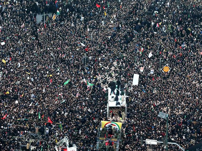 Iranians gather around a vehicle carrying the coffin of major general Qassem Soleimani. Picture: AFP