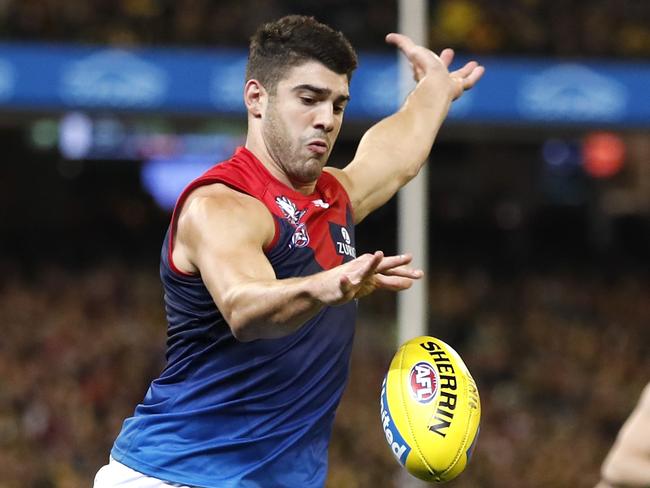 MELBOURNE, AUSTRALIA - APRIL 24: Christian Petracca of the Demons kicks the ball during the 2019 AFL round 06 match between the Richmond Tigers and the Melbourne Demons at the Melbourne Cricket Ground on April 24, 2019 in Melbourne, Australia. (Photo by Dylan Burns/AFL Photos)