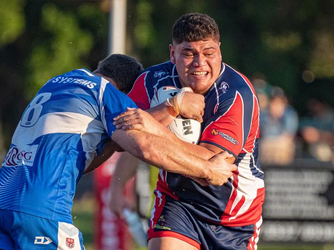 Tugun's Josh Harvey wraps up the ball as Runaway Bay's Doryaan Hape Apiata takes a hit-up. Picture: Kris Matthews