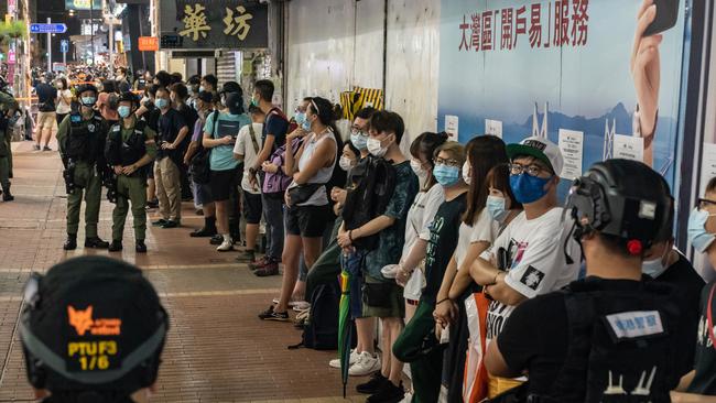 Riot police detain a group of people during an anti-government protest on September 6. Picture: Getty Images