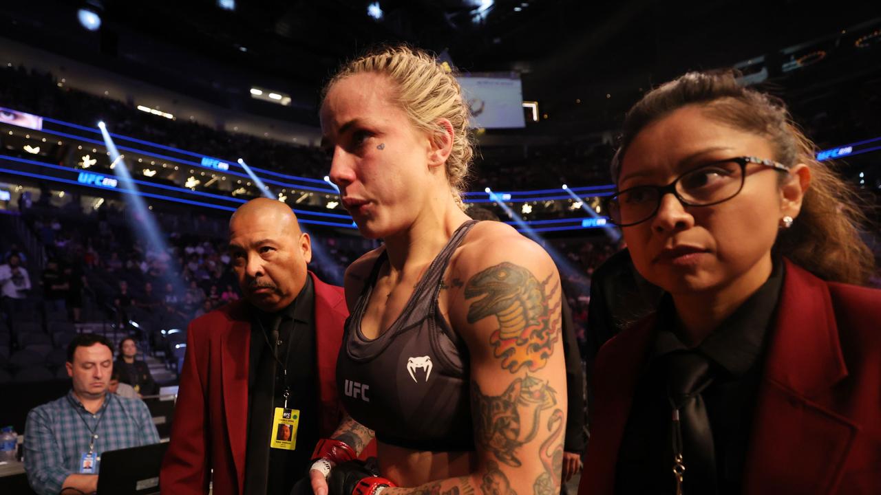 Jessica-Rose Clark of Australia exits the octagon after a first round submission loss to Julija Stoliarenko of Lithuania in July.