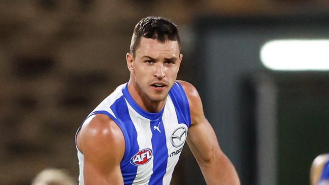 ADELAIDE, AUSTRALIA - APRIL 05: Luke Davies-Uniacke of the Kangaroos in action during the 2024 AFL Round 04 match between the Brisbane Lions and the North Melbourne Kangaroos at Norwood Oval on April 05, 2024 in Adelaide, Australia. (Photo by Dylan Burns/AFL Photos via Getty Images)