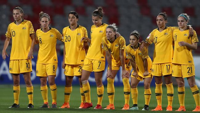 Australia players look on anx look on anxiously during the shootout.
