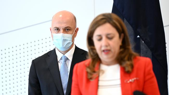 Queensland Premier Annastacia Palaszczuk, flanked by Chief Health Officer Dr John Gerrard. Picture: NCA NewsWire / Dan Peled