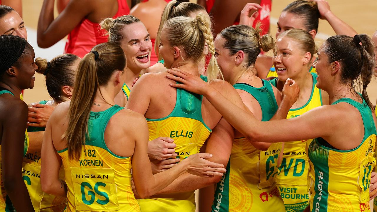 Diamonds players mob Rudi Ellis after here Australian debut. Picture: Sarah Reed/Getty Images