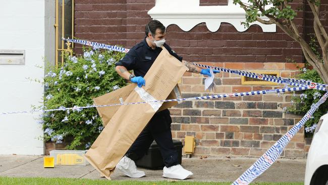 Police outside the Annandale home on Monday. Picture: Richard Dobson