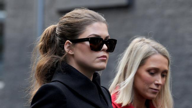 Belle Gibson, left, arrives at the Federal Court in Melbourne as Consumer Affairs tries to enforce a $410,000 fine. Picture: Andrew Henshaw