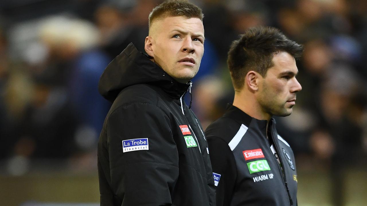 MELBOURNE, AUSTRALIA - SEPTEMBER 06: Jordan De Goey and Levi Greenwood of the Magpies walk off the field during the AFL 1st Qualifying Final match between the Geelong Cats and the Collingwood Magpies at the Melbourne Cricket Ground on September 06, 2019 in Melbourne, Australia. (Photo by Quinn Rooney/Getty Images)