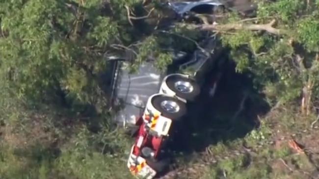 A truck driver has died after his truck rolled in the Gold Coast hinterland on Monday morning. Picture: 7 News