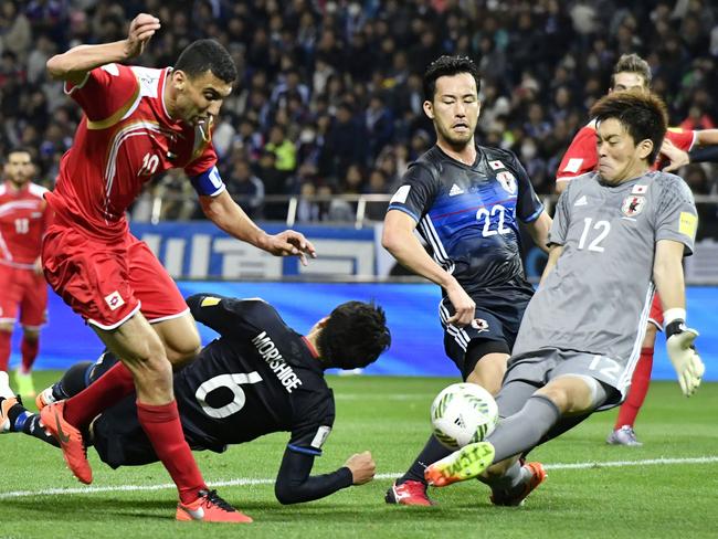 Syria's Abdul Razak Al Hussein is denied in his side’s recent loss to Japan. Picture: Yohei Nishimura/Kyodo News via AP