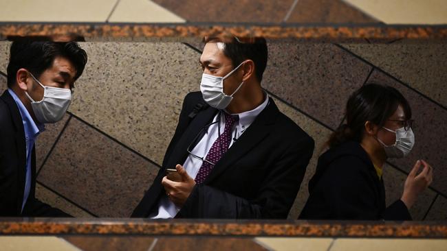 Commuters in Tokyo are trying to stay healthy. Photo: Charly Triballeau / AFP