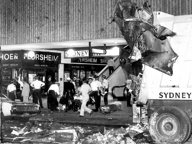 1978: Police attend the scene of a bomb blast outside Sydney’s Hilton Hotel. The explosion killed rubbish collectors Alec Carter and William Favell and policeman Paul Burmistriw, who was guarding the entrance to the hotel lounge, died later in hospital. File picture