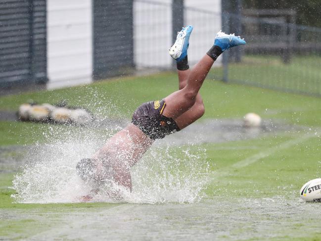 The Brisbane Broncos trained through the downpour at Red Hill. Pic Peter Wallis